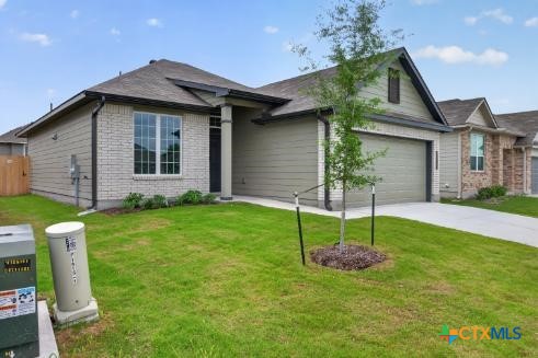 1915 Meridian Loop Temple, TX 76504 - Photo 3 of 29 a front view of a house with a garden
