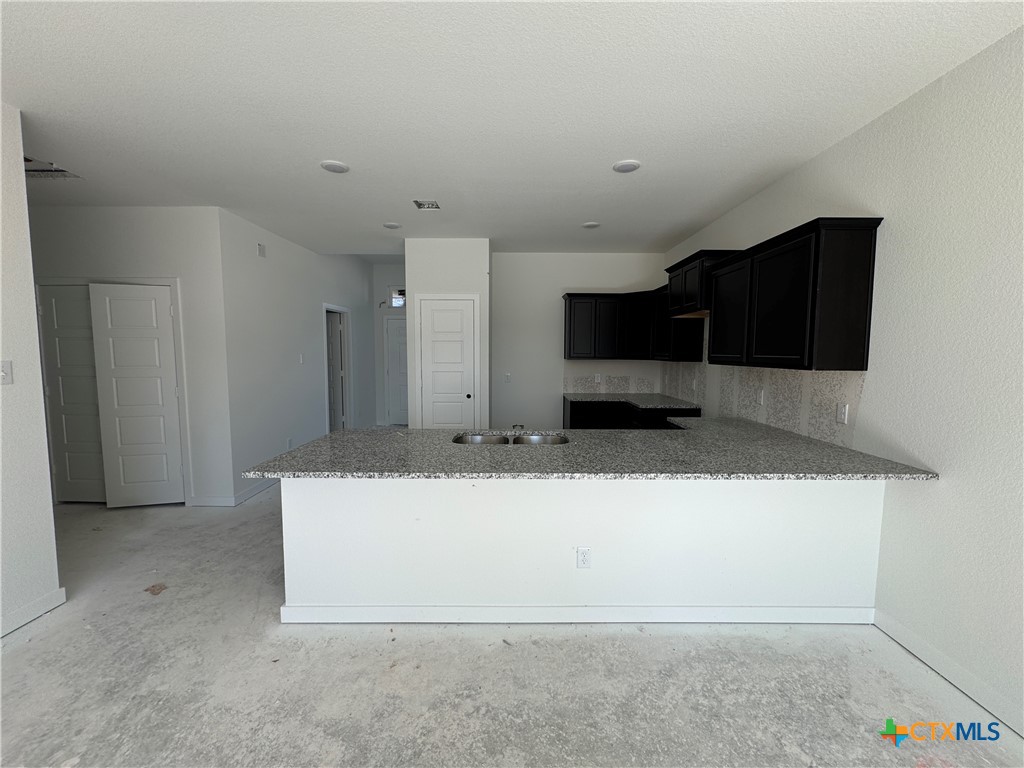 1915 Meridian Loop Temple, TX 76504 - Photo 5 of 13 a view of kitchen with stainless steel appliances a refrigerator and a microwave