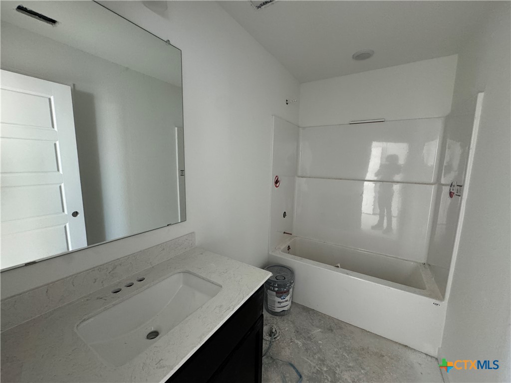 1915 Meridian Loop Temple, TX 76504 - Photo 6 of 13 a bathroom with a bathtub and a sink