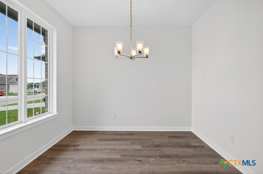 1915 Meridian Loop Temple, TX 76504 - Photo 7 of 29 a view of a room with wooden floor and windows