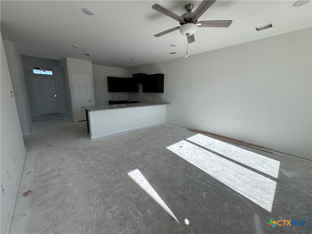 1915 Meridian Loop Temple, TX 76504 - Photo 8 of 13 en empty room with projector and a ceiling fan