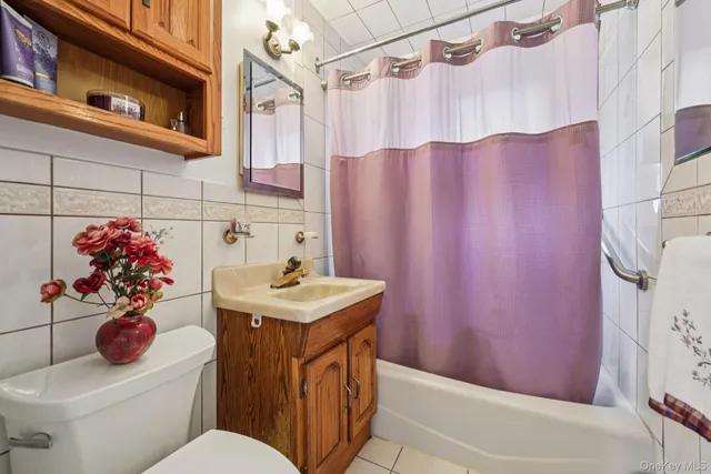 a bed room with a bed window and a chair