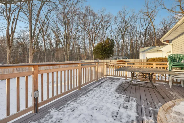 a view of a two chairs in the balcony