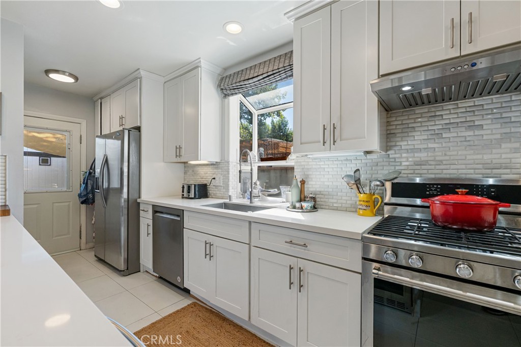 16762 Otsego Street Encino, CA 91436 - Photo 7 of 54 Gourmet Chef's kitchen with exquisite quartz counter tops, and backsplah