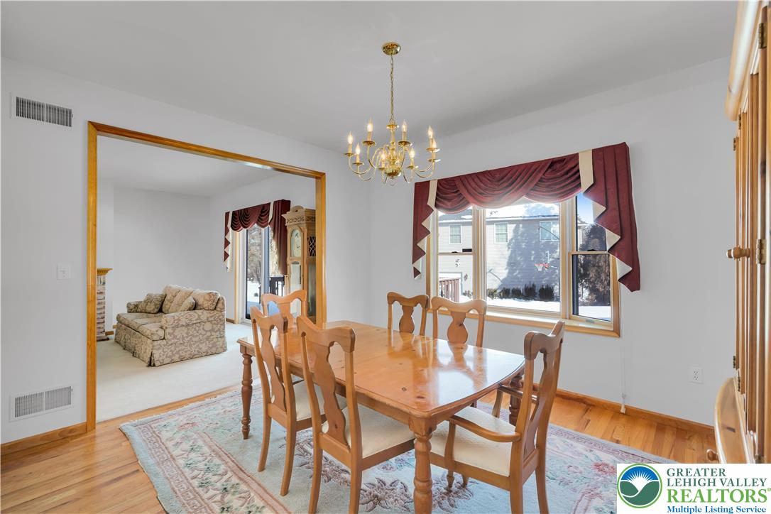 239 North 36th Street Allentown, PA 18104 - Photo 11 of 38 a dining room with furniture and chandelier