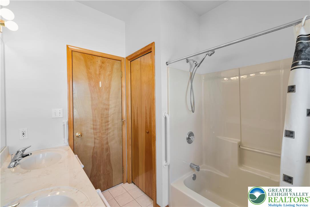 239 North 36th Street Allentown, PA 18104 - Photo 17 of 38 a bathroom with a bathtub shower and a sink