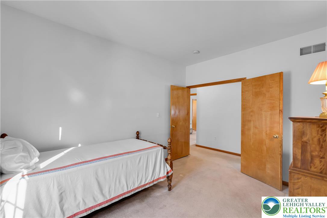 239 North 36th Street Allentown, PA 18104 - Photo 21 of 38 a bedroom with a bed and a painting on the wall