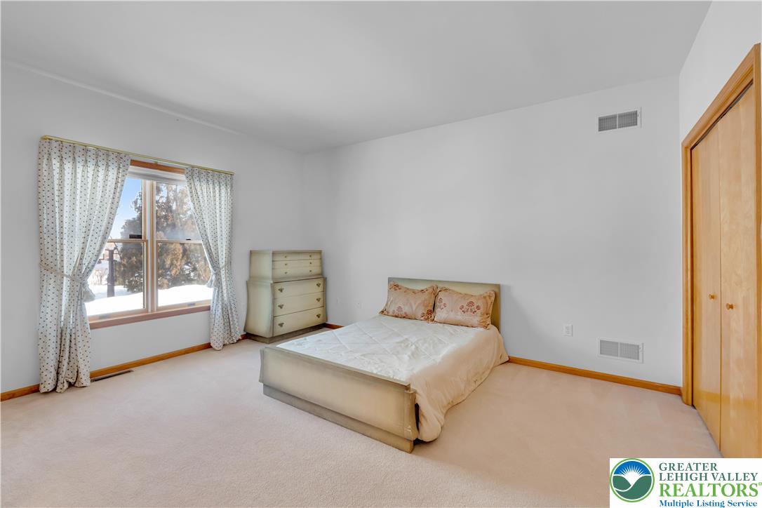 239 North 36th Street Allentown, PA 18104 - Photo 24 of 38 a spacious bedroom with a bed and a window