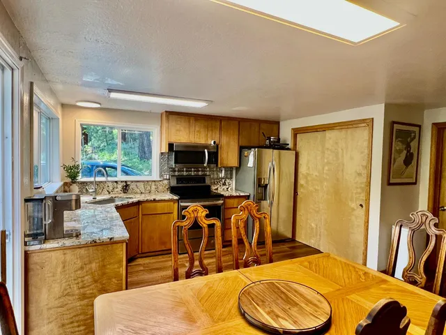 a view of a dining room with furniture window and outside view