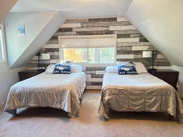 a bedroom with bed and a window