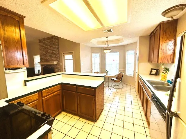 a very nice looking kitchen with a large window