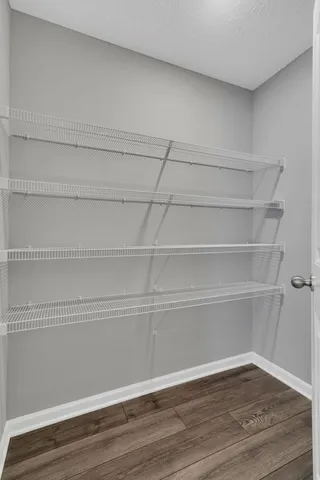 a large kitchen with stainless steel appliances granite countertop a stove a sink and a refrigerator