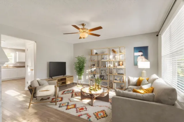 a living room with furniture and a flat screen tv