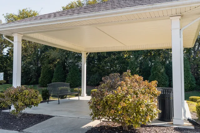 a kitchen with stainless steel appliances a sink and a refrigerator