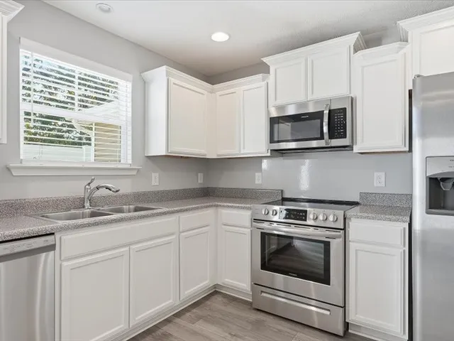 a car parked in front of a brick house