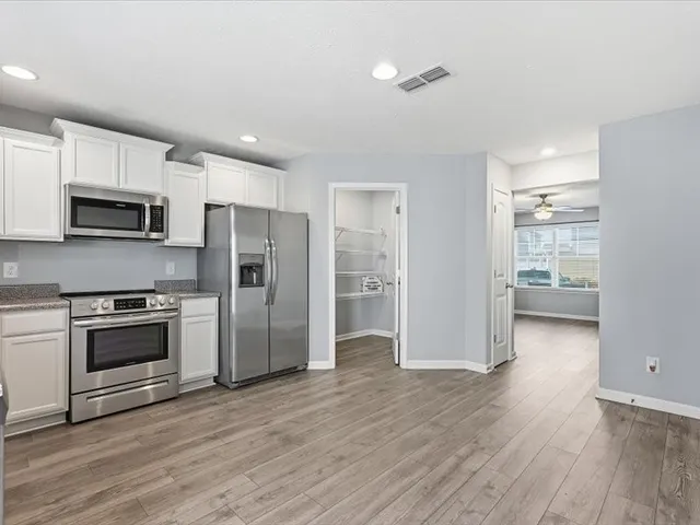 a bathroom with a sink toilet and vanity