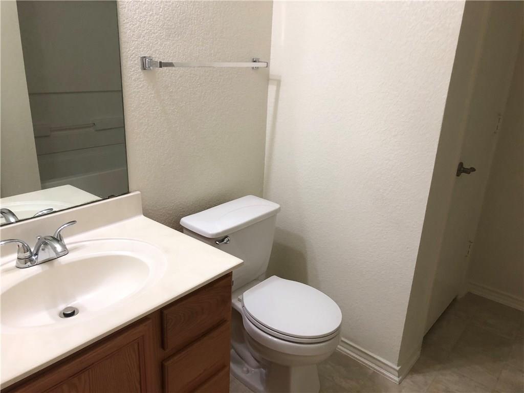 6912 Walkup Lane Austin, TX 78747 - Photo 7 of 14 a bathroom with a sink and a toilet