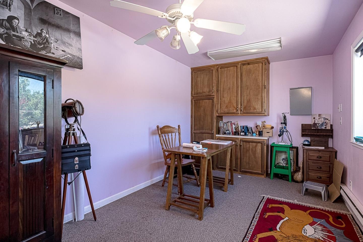 3719 North Hart Road Modesto, CA 95358 - Photo 12 of 47 a view of a workspace with furniture and a window