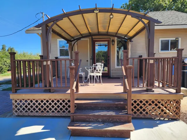 a view of a chairs and table on the deck