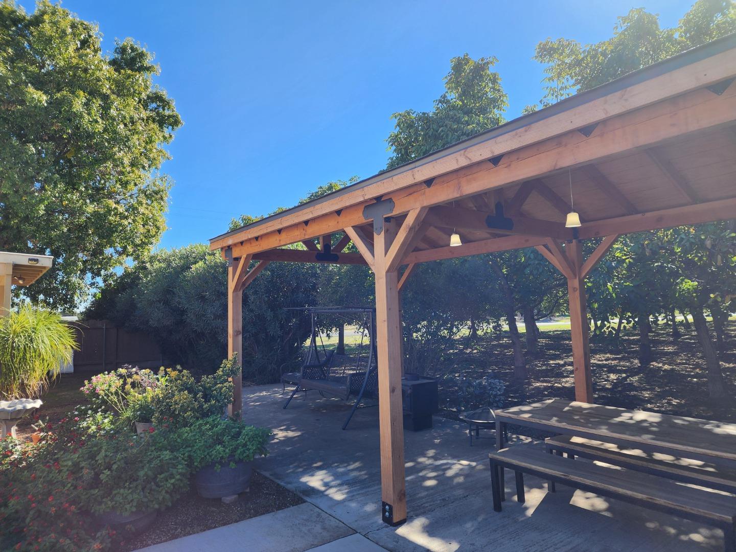 3719 North Hart Road Modesto, CA 95358 - Photo 37 of 47 a view of a patio with table and chairs with wooden fence
