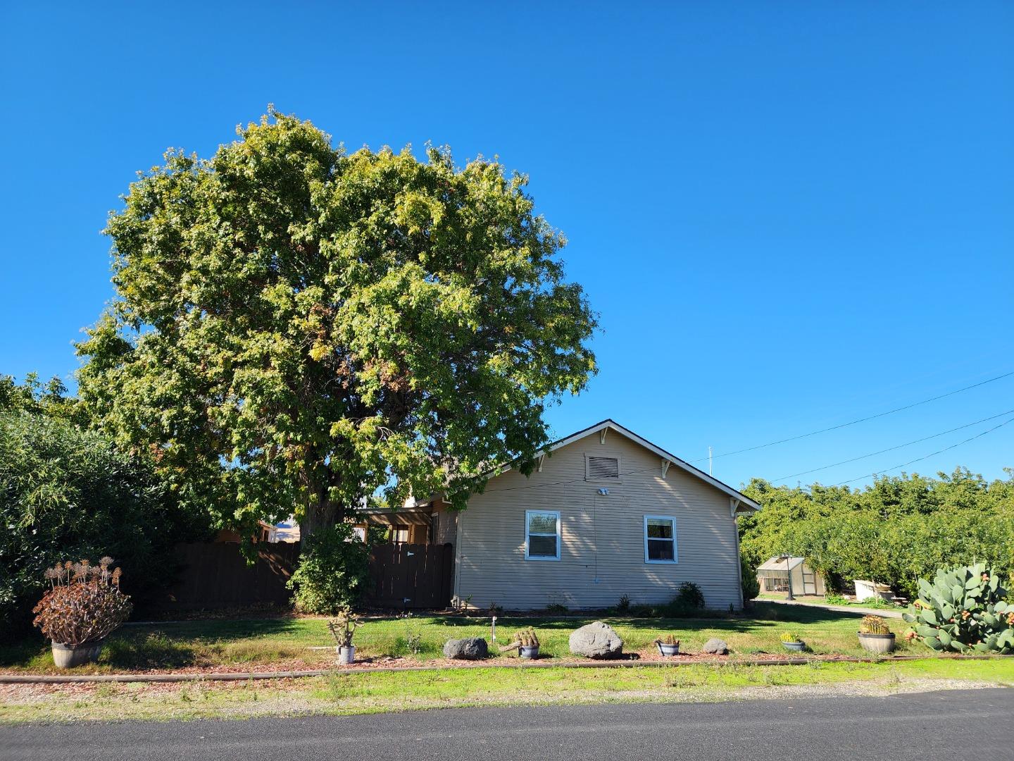 3719 North Hart Road Modesto, CA 95358 - Photo 44 of 47 a front view of a house with a yard