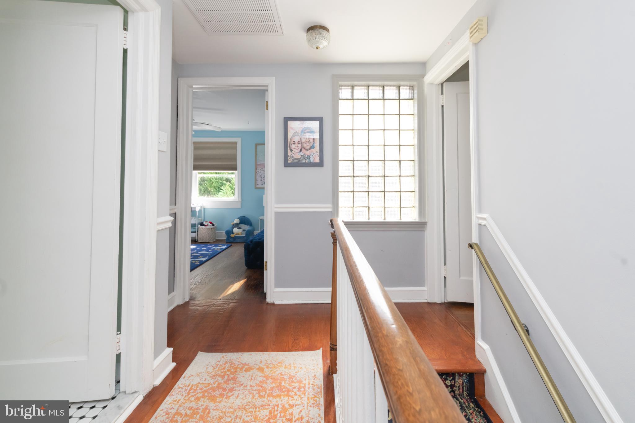 239 Hopkins Road Haddonfield, NJ 08033 - Photo 44 of 76 a view of a hallway with furniture and floor to ceiling window