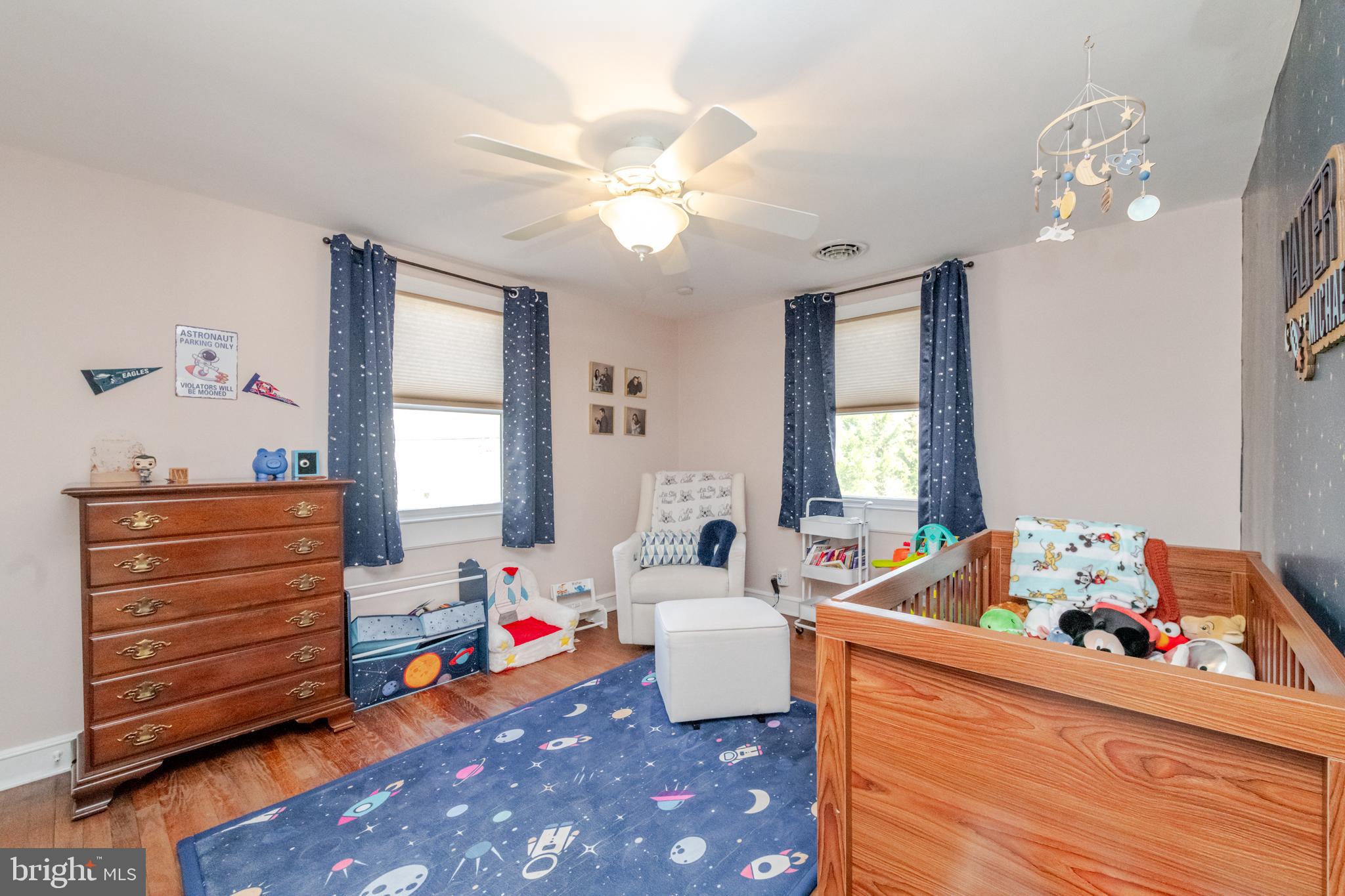 239 Hopkins Road Haddonfield, NJ 08033 - Photo 48 of 76 a room with furniture a chandelier and a window
