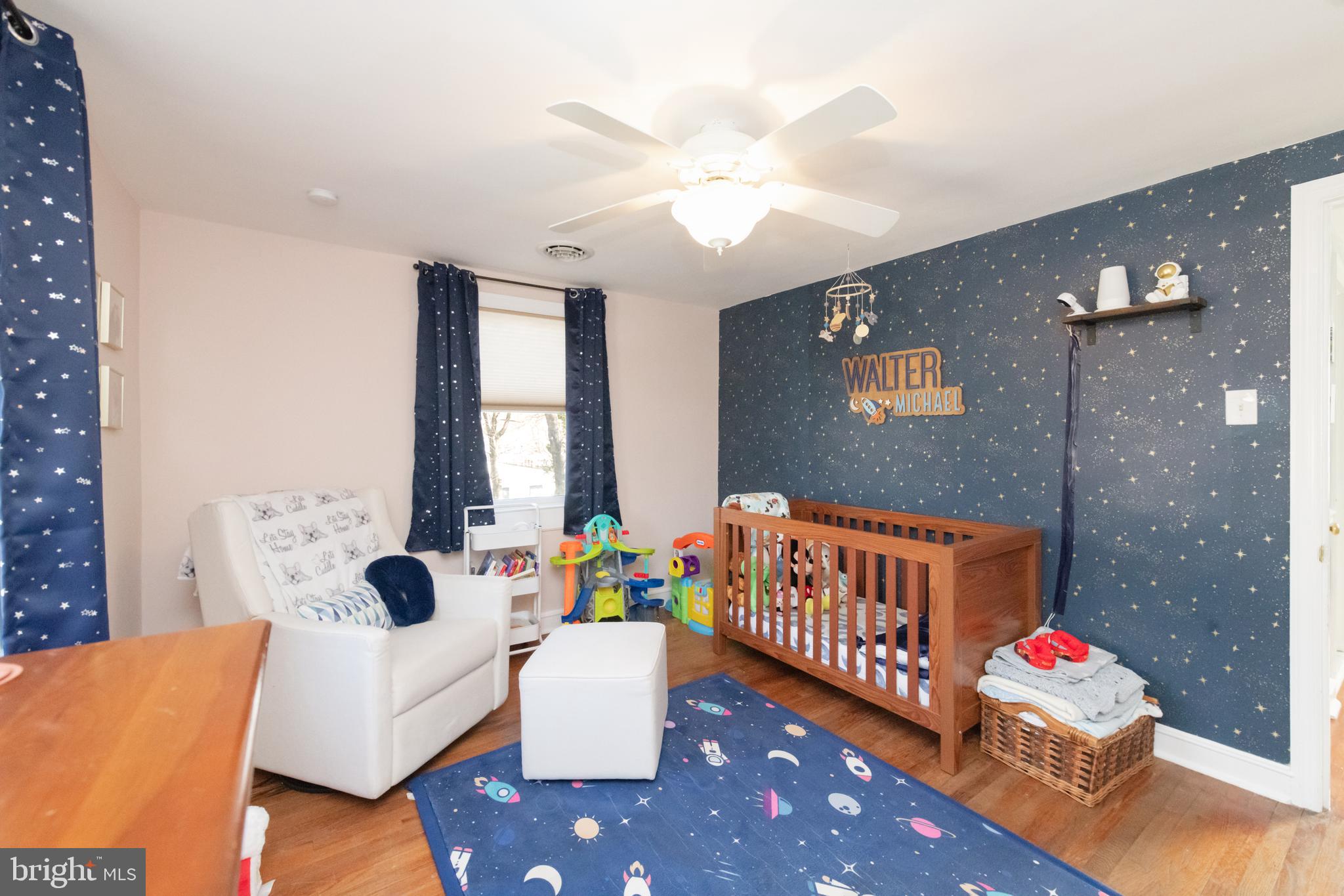 239 Hopkins Road Haddonfield, NJ 08033 - Photo 49 of 76 a bedroom with furniture and a large window