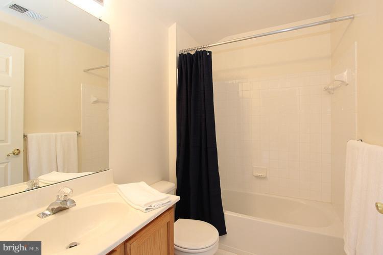 14422 Autumn Crest Road Boyds, MD 20841 - Photo 22 of 24 a bathroom with a sink and a mirror