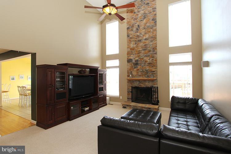 14422 Autumn Crest Road Boyds, MD 20841 - Photo 5 of 24 a living room with furniture and a fireplace