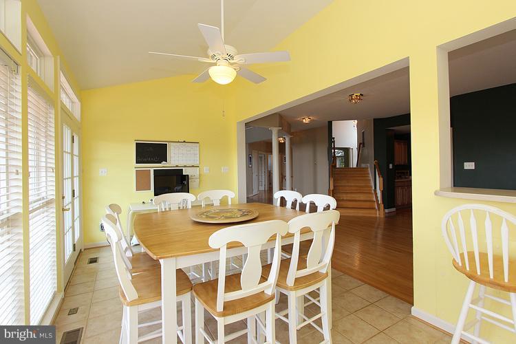 14422 Autumn Crest Road Boyds, MD 20841 - Photo 7 of 24 a view of a dining room with furniture and a chandelier