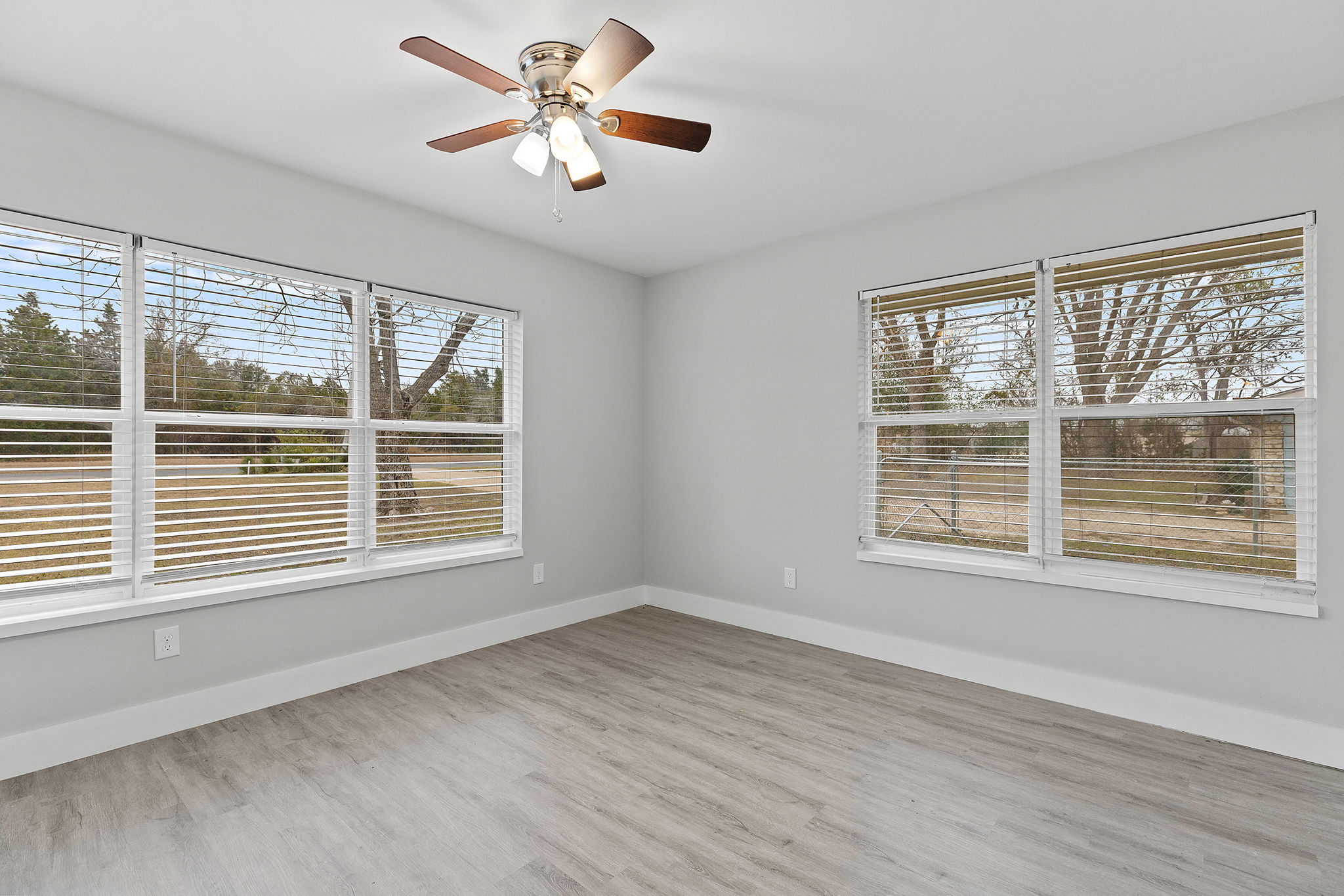 813 Central Avenue Elgin, TX 78621 - Photo 14 of 22 Spare room featuring light wood-type flooring and a ceiling fan