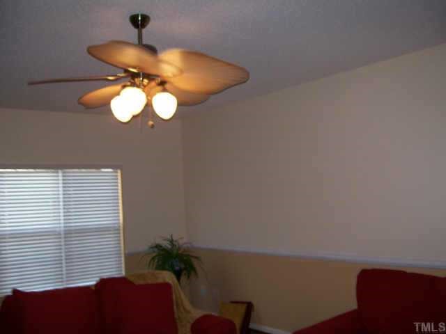 3404 Sosa Road Raleigh, NC 27610 - Photo 8 of 10 a view of a chandelier fan and a window