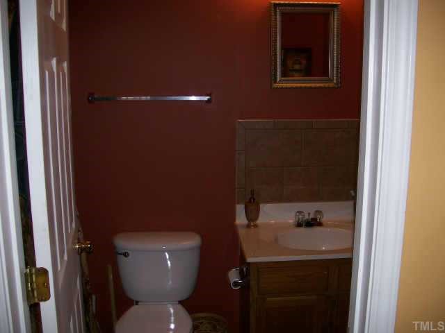 3404 Sosa Road Raleigh, NC 27610 - Photo 9 of 10 a bathroom with a toilet and a sink