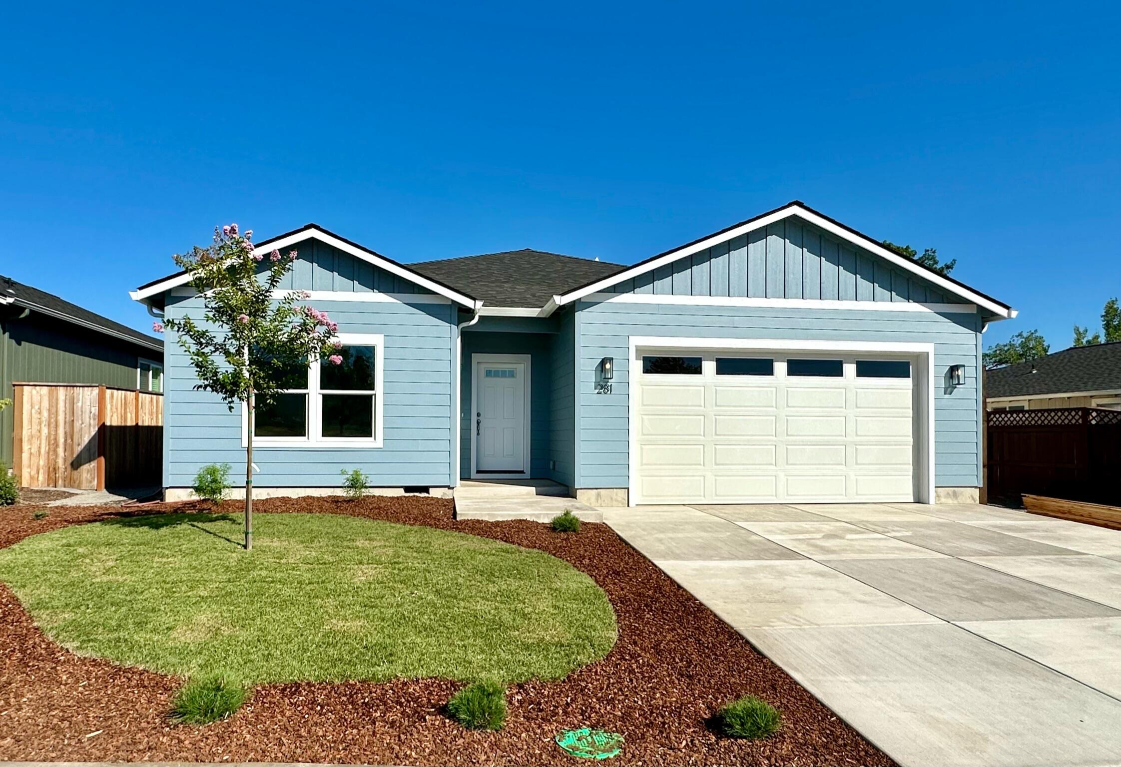281 Autumn Ridge Road Talent, OR 97540 - Photo 1 of 39 a front view of a house with a yard