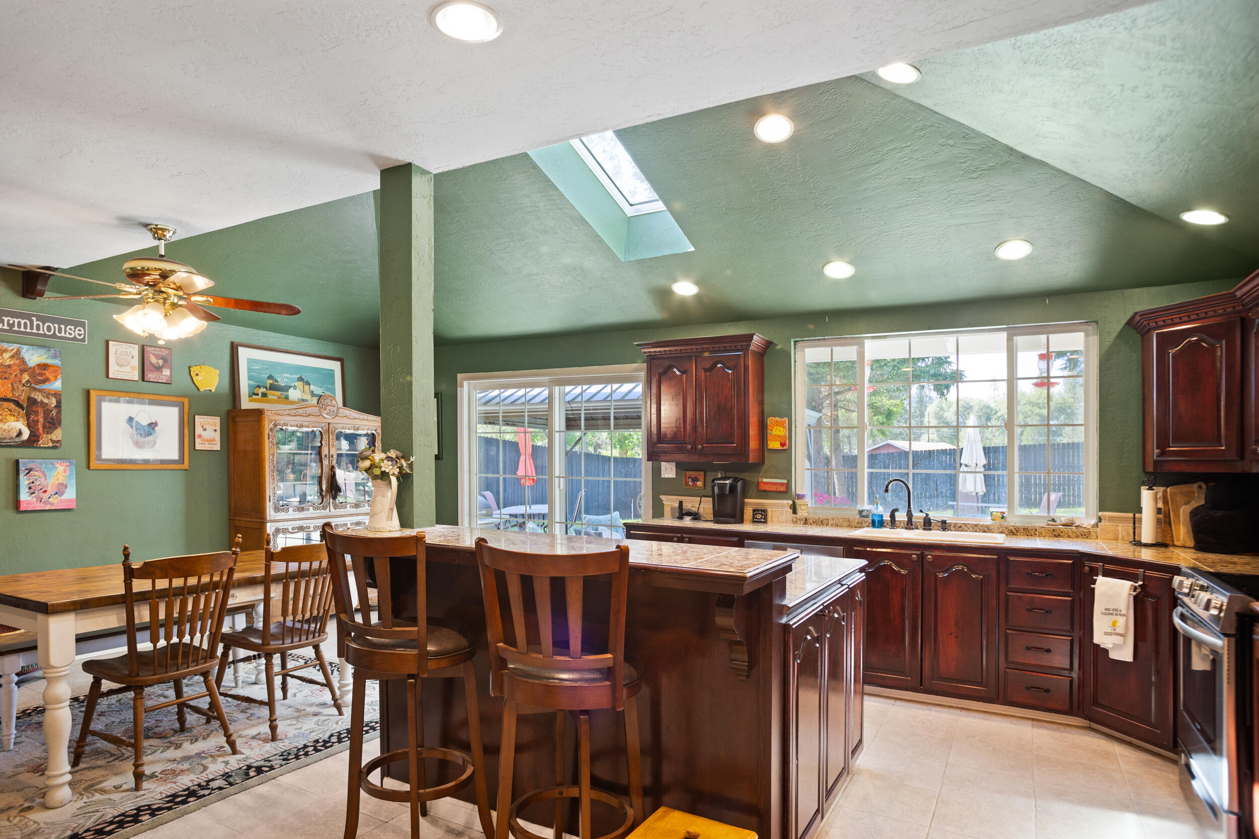 255 Queens Branch Road Rogue River, OR 97537 - Photo 8 of 60 a kitchen with a table chairs sink and cabinets