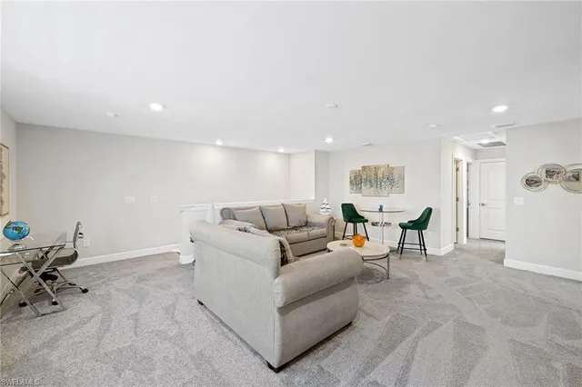 a living room with furniture and a table