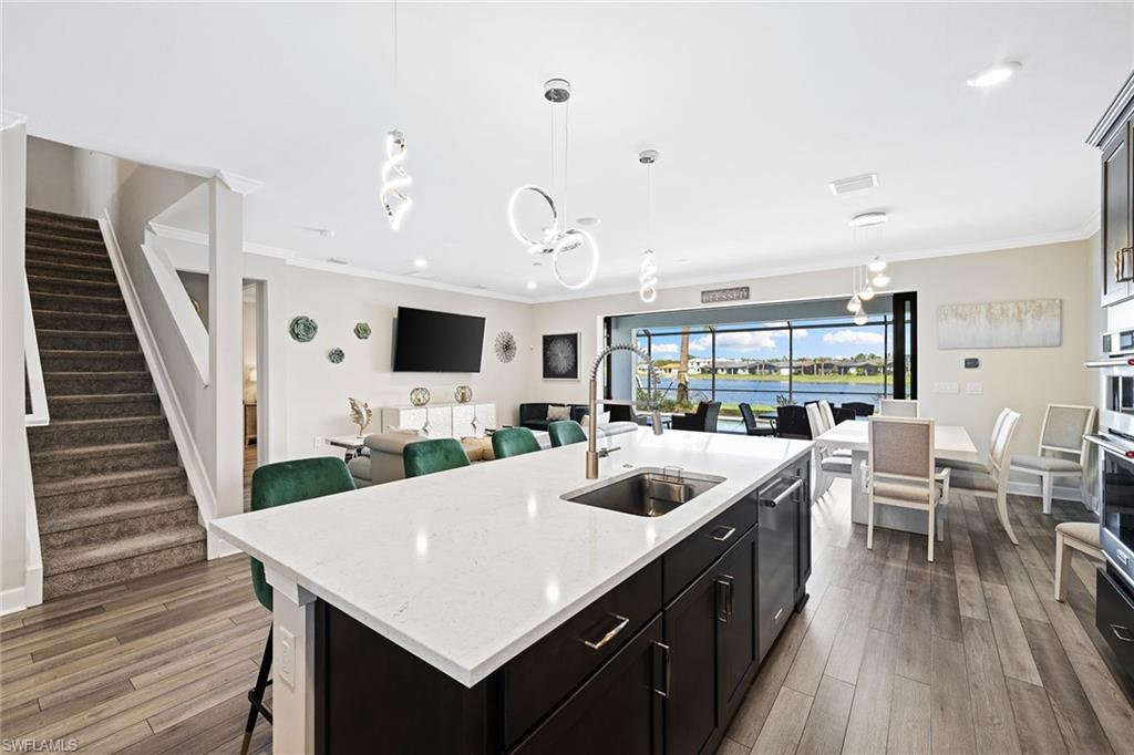 1973 Yellowfin Circle Naples, FL 34114 - Photo 22 of 44 a large white kitchen with a table and chairs