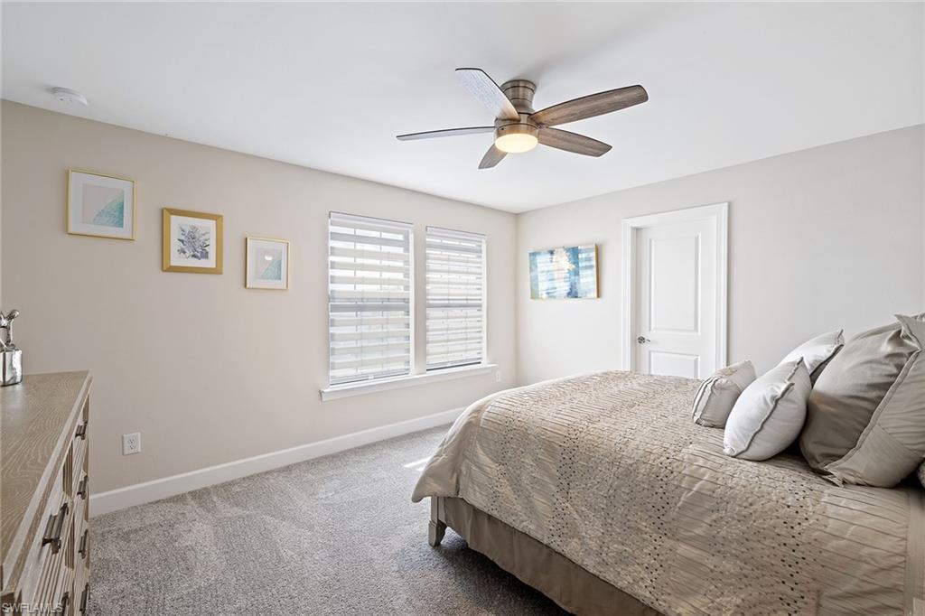 1973 Yellowfin Circle Naples, FL 34114 - Photo 29 of 44 a bedroom with a bed and window
