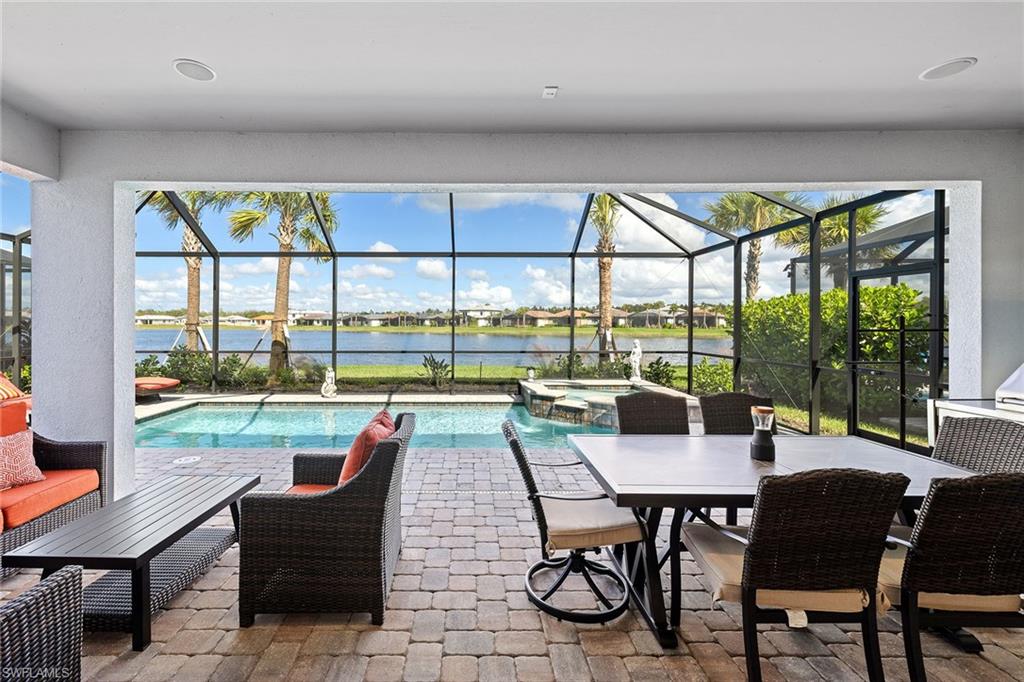 1973 Yellowfin Circle Naples, FL 34114 - Photo 37 of 44 a living room with furniture and a floor to ceiling window