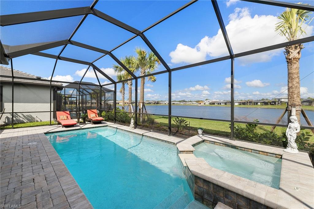 1973 Yellowfin Circle Naples, FL 34114 - Photo 40 of 44 a view of swimming pool with a lounge chair