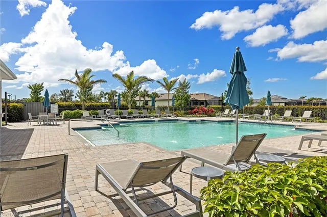 a view of a lake with a table and chairs