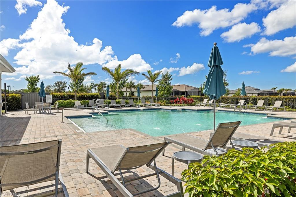 1973 Yellowfin Circle Naples, FL 34114 - Photo 41 of 44 a view of a lake with a table and chairs