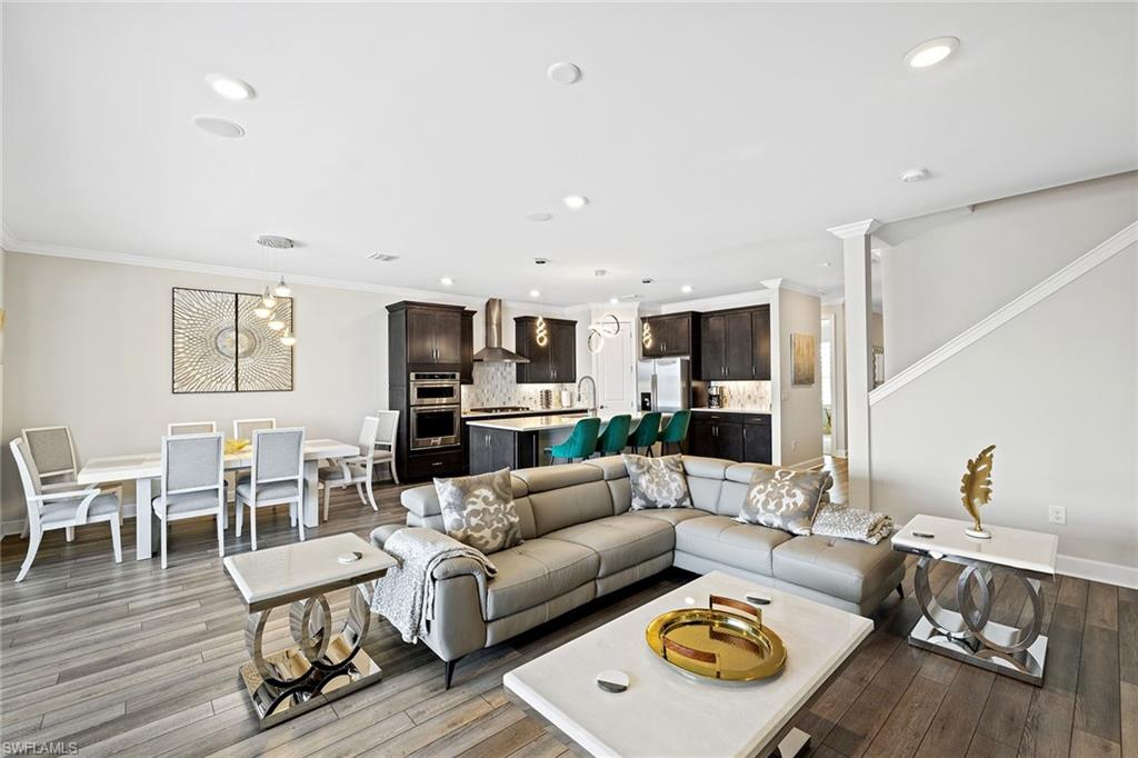 1973 Yellowfin Circle Naples, FL 34114 - Photo 10 of 44 a living room with furniture and a wooden floor
