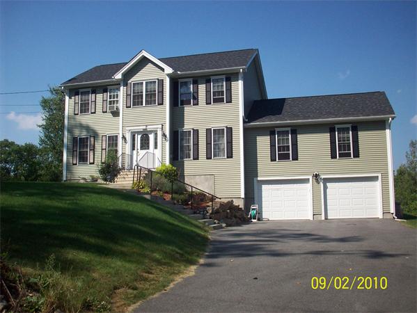 162 County Road Ashby, MA 01431 - Photo 1 of 1 a front view of a house with garden