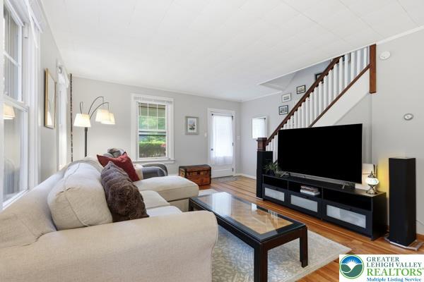 2021 Leithsville Road Hellertown, PA 18055 - Photo 7 of 39 Hardwood floors complement the spacious living room with natural light.
