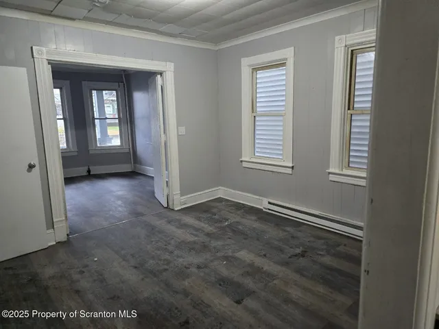 an empty room that has a window