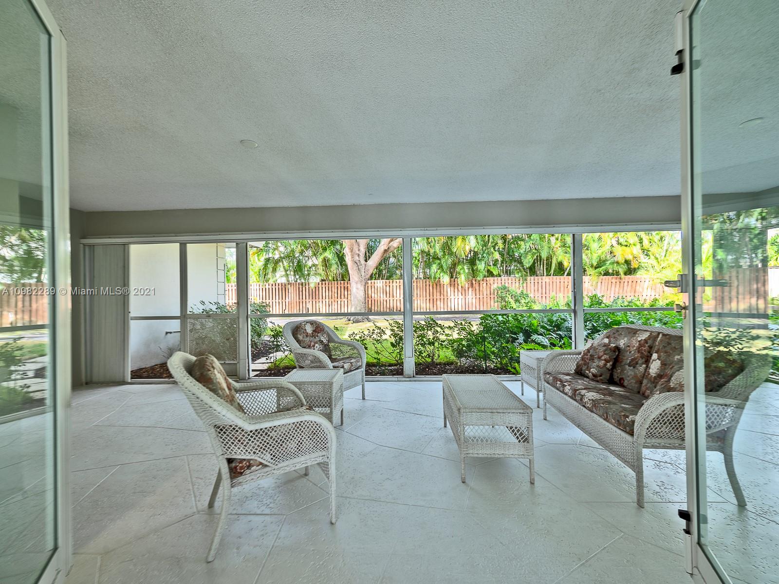 17 Minnetonka Road Sea Ranch Lakes, FL 33308 - Photo 23 of 39 Large Florida Room/Back Patio