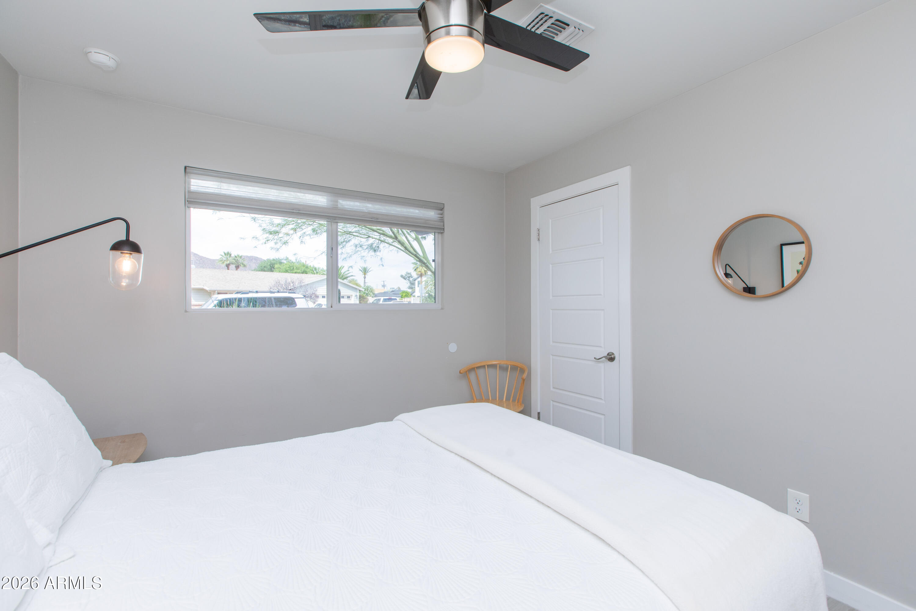 5541 East Cheery Lynn Road Phoenix, AZ 85018 - Photo 38 of 69 a bedroom with a bed and window