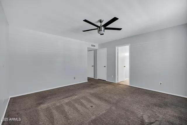 a view of a big room with carpet